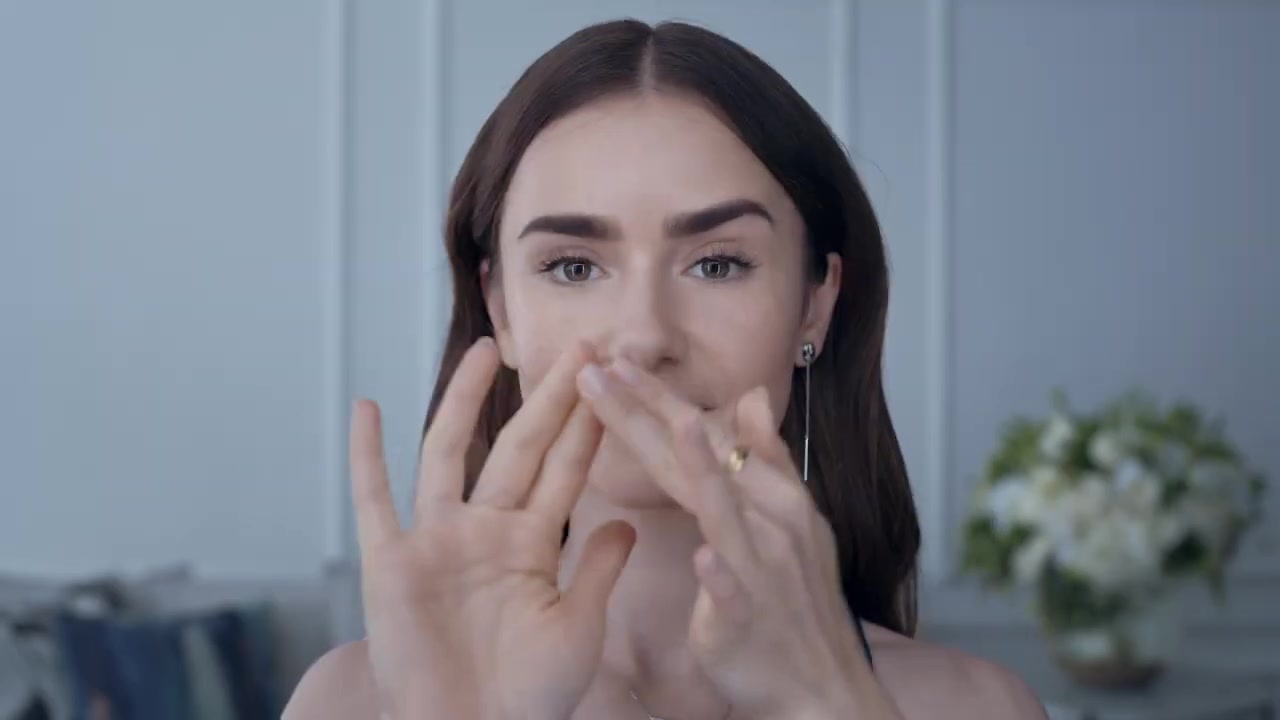 15_seconds_to_Youthful2C_Brighter_Eyes_with_Lily_Collins_-_NEW_Advanced_Genifique_Eye_Cream_022.jpg